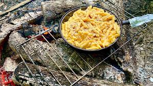 Alfredo Pasta over a campfire in a pan